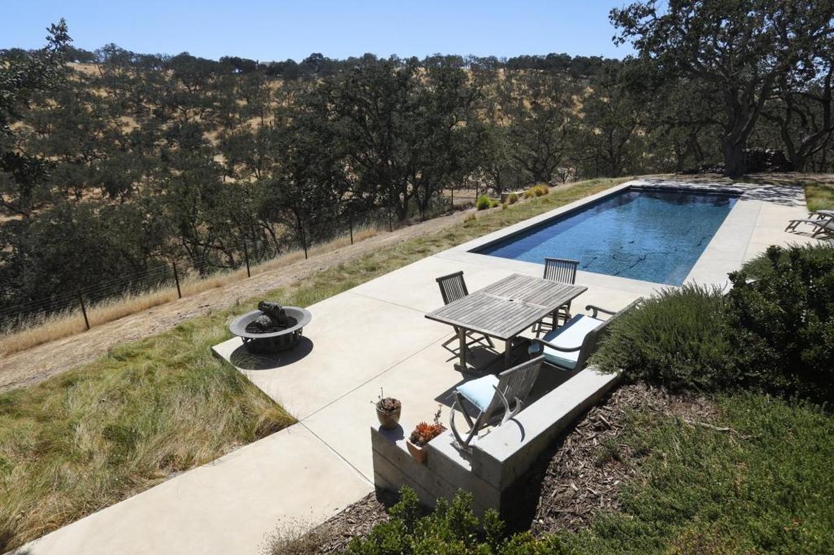 A saltwater pool gives Douglas Kilgour and Anne Hilbert a break from sweltering summer heat in rural Paso Robles.