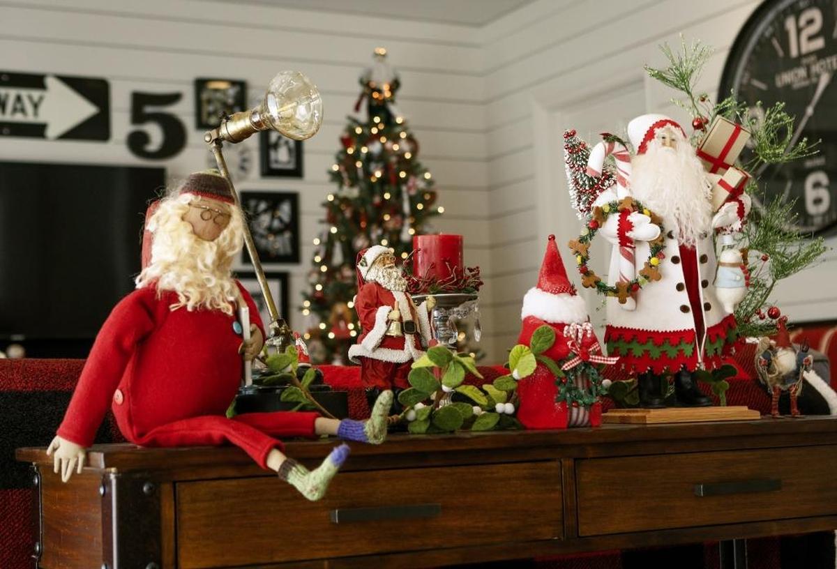 During the holidays, the Palmer home in San Luis Obispo offers a warm, welcoming backdrop for Christmas collectibles such as these Santas.