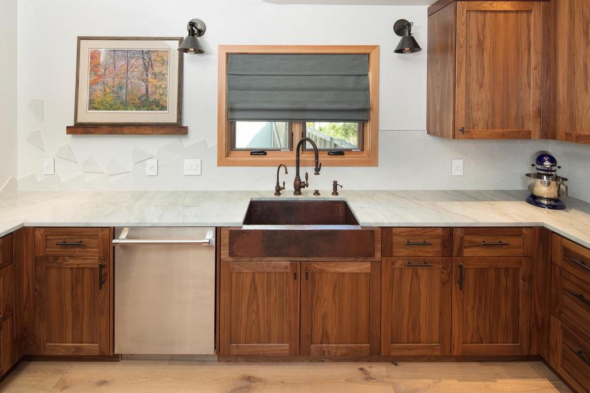 The kitchen backsplash tiles are kite-shaped, so Zoe Sunderland suggested that one edge look as if the kites are breaking off and taking flight.