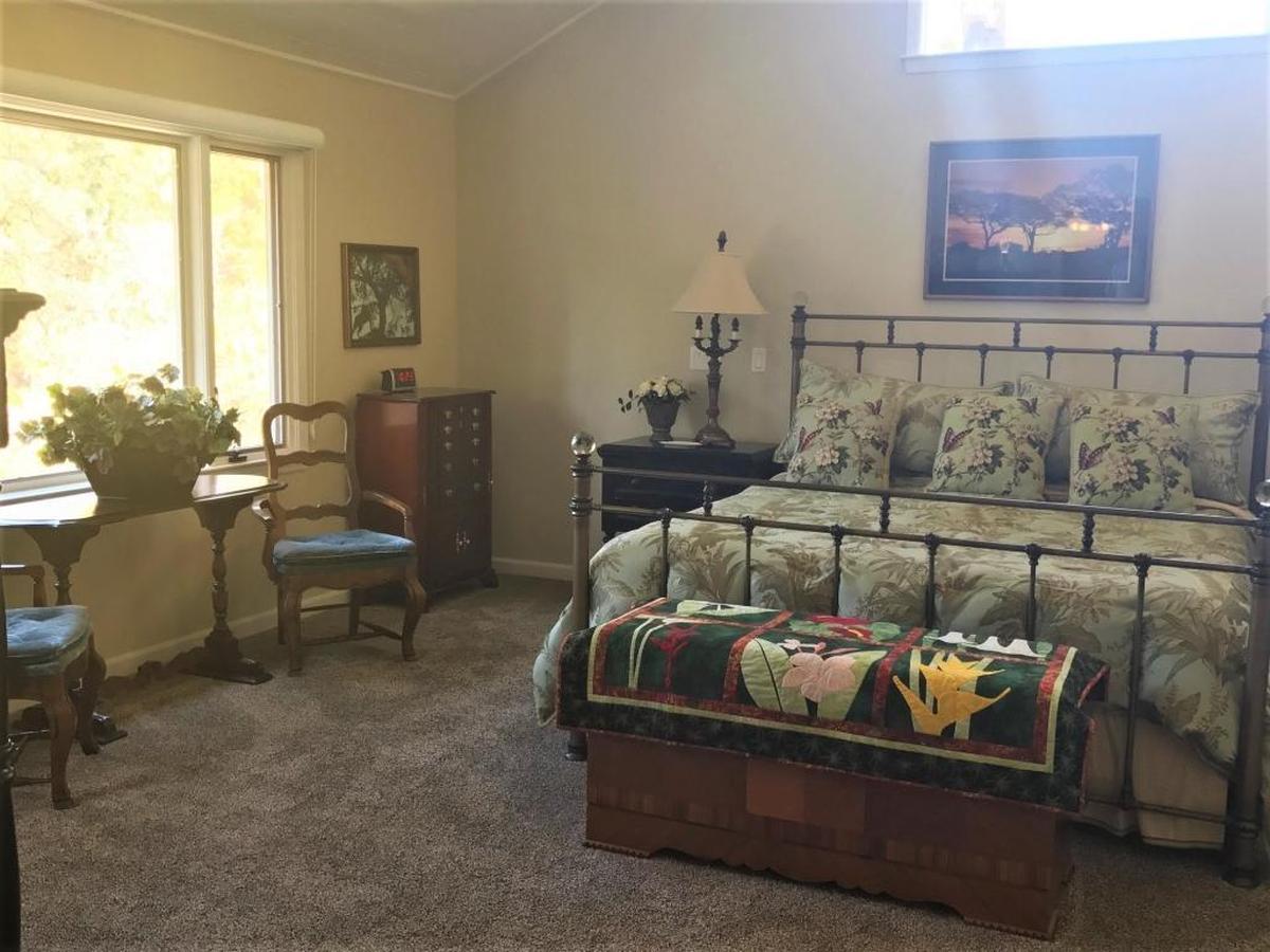 The master bedroom suite is a large, open area that includes a library at the Clark home in Cambria.