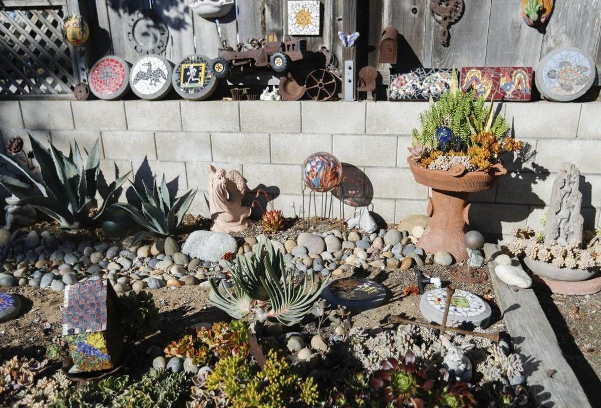 Ann Hodges mixes succulents, mosaic-covered stepping stones and found objects in her garden in Los Osos.