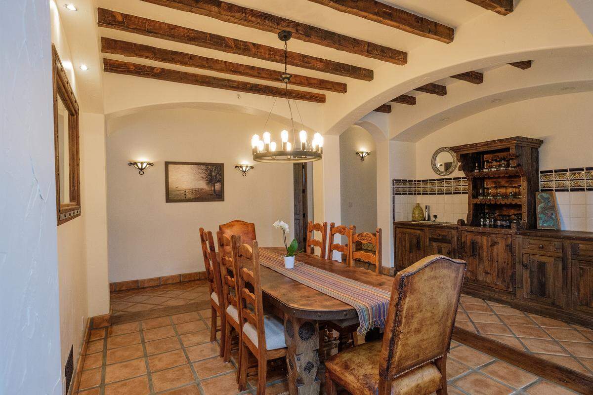 Massive rustic cabinets were designed to fit snugly into niches in the San Luis Obispo home of Bambi and Christopher Banys.
