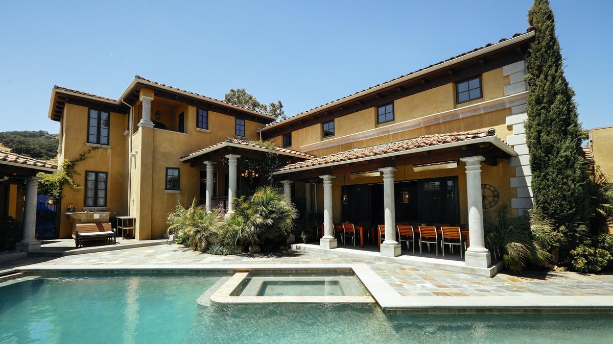 Most gatherings at Rushdi and Nisha Abdul Cader's San Luis Obispo home gravitate toward their lavish pool and patio area.
