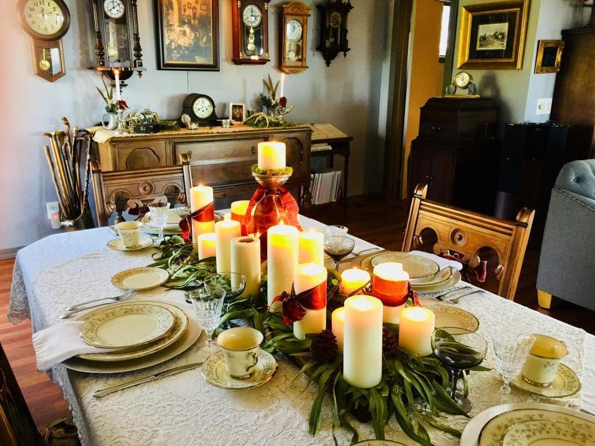 Traditional holiday decorations complement the antiques in Travis and Steve Srott’s English-style cottage in Cambria.
