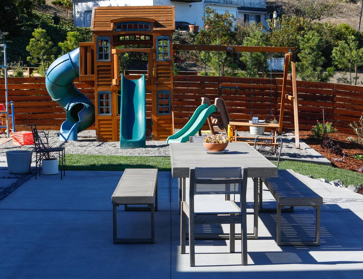 The renovated backyard of Brian and Shelle Ball’s San Luis Obispo home features play areas for children and dogs and entertaining spaces for grownups.