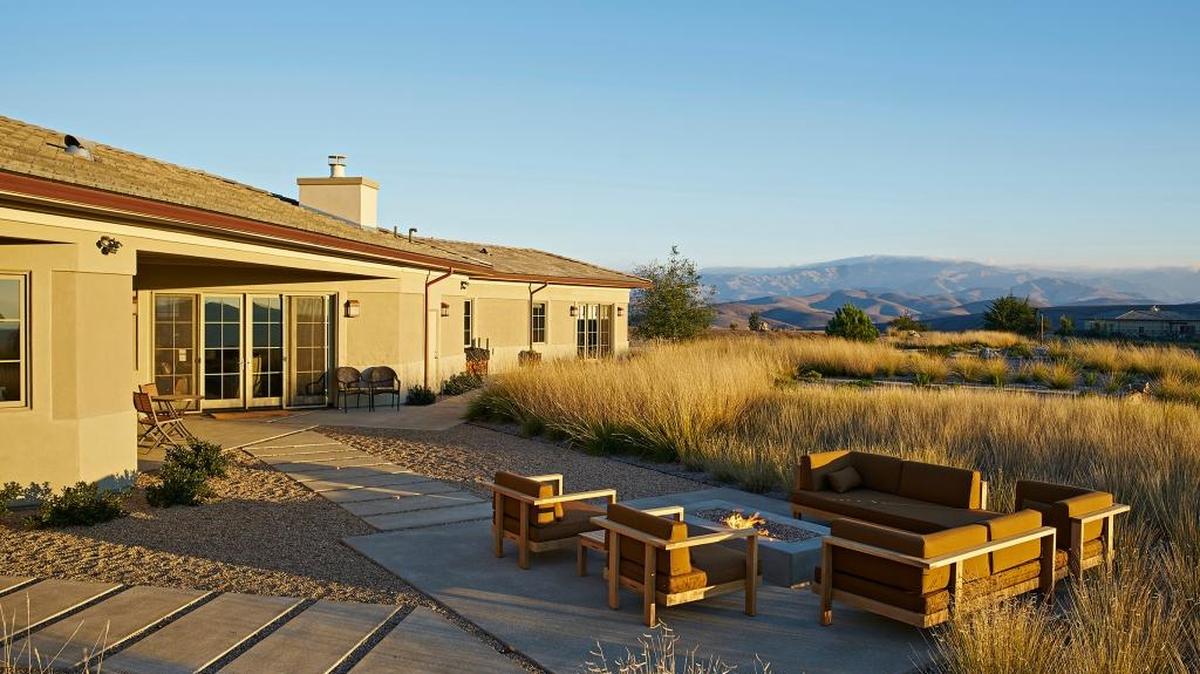 The Nichters’property includes several outdoor living spaces surrounded by native landscaping.