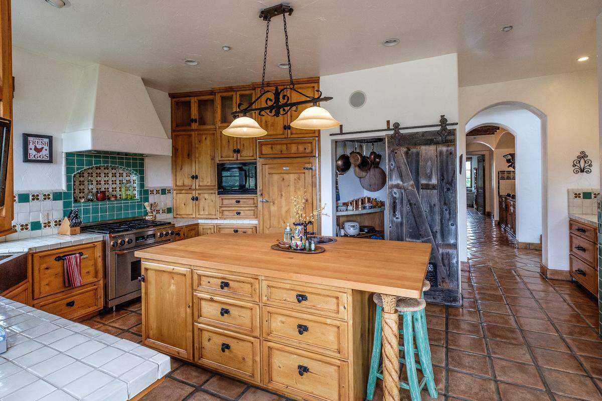Spanish-style tiles lend a vintage look to the kitchen of the San Luis Obispo home of Bambi and Christopher Banys.