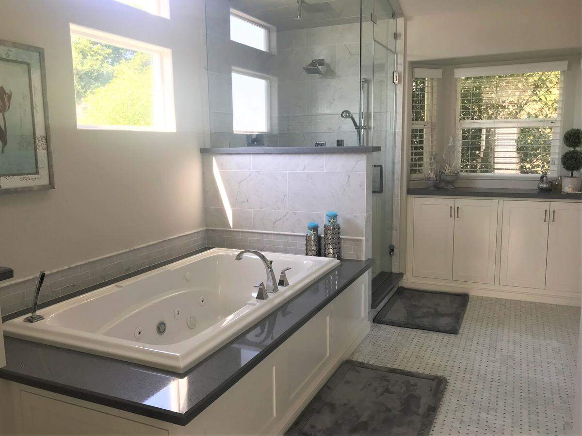 The master bathroom of Jeff and Melinda Baker’s Cambria home resembles a spa with a jetted tub and steam shower.