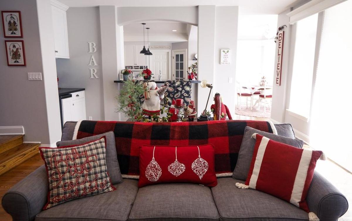 Farmhouse-red accents are balanced with neutral furniture in the Palmer home in San Luis Obispo.
