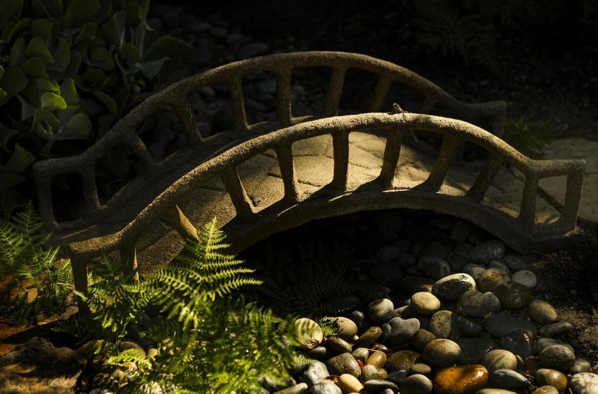 A miniature bridge that’s knee-high was built by Tara Storke’s grandfather and is featured at Oak Haven Gardens. She and her husband Richard Gormley created the serene landscape in Arroyo Grande.