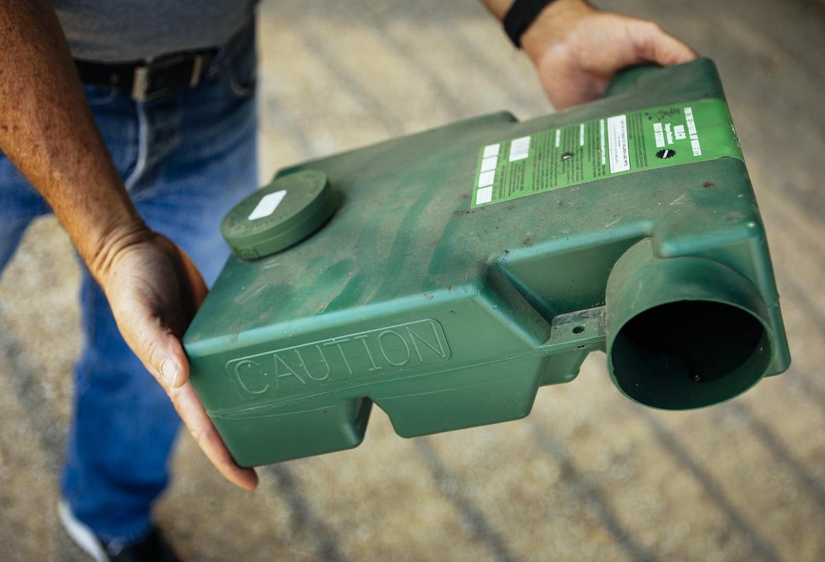 Ray Festa, UCCE Master Gardener, holds a Wilco Ground Squirrel Bait Station.