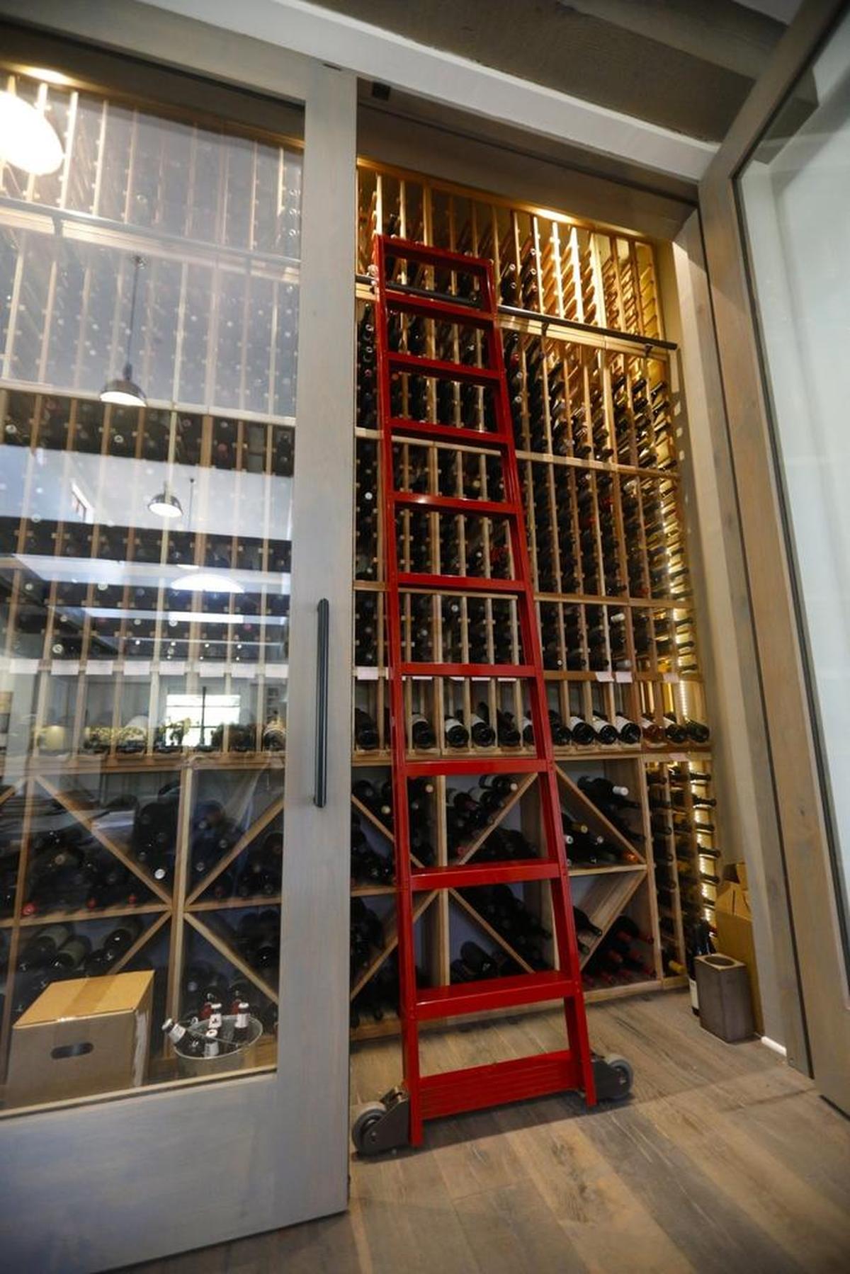 A 1,000-bottle wine cellar is at the end of the great room. The 12-by-12 foot showpiece gleams from behind 10-foot-high glass doors.