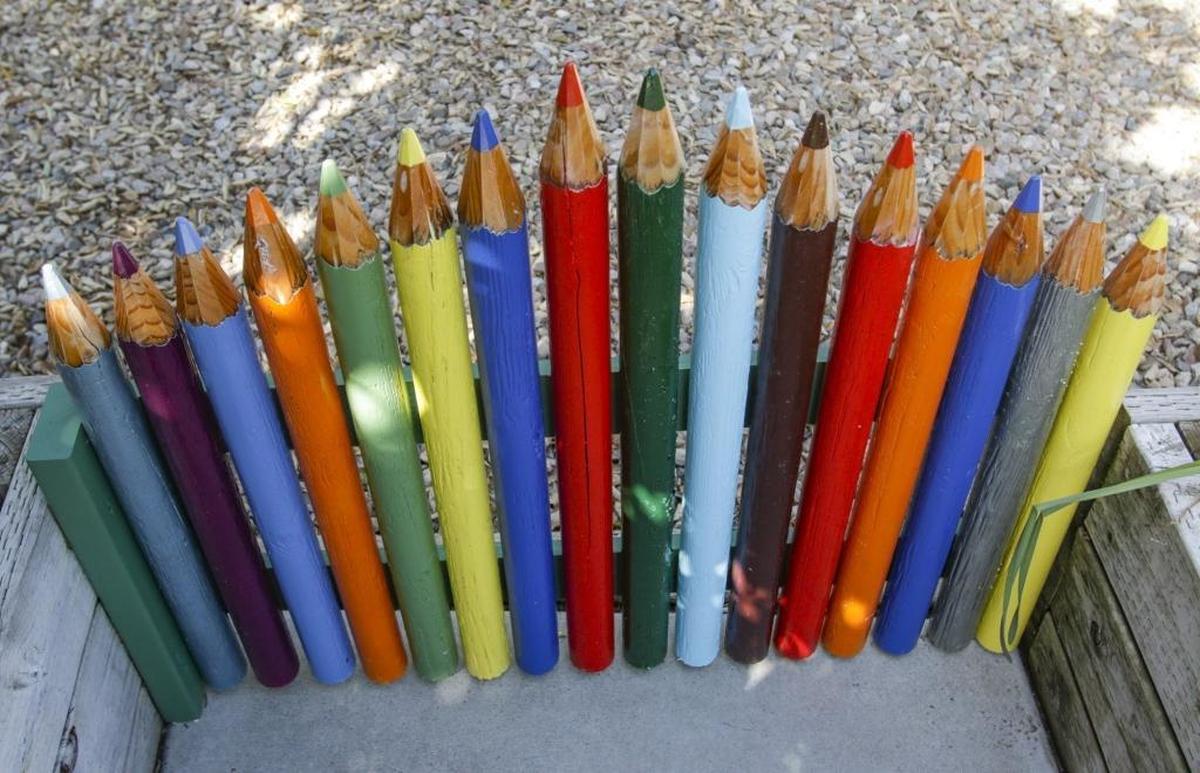 The garden gate was designed by Bobbye West Thompson and built by her husband, Kim, as a nod to Bobbye’s past profession as a teacher.