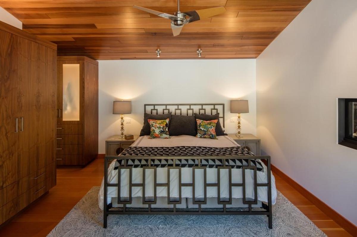 Wood ceilings add warmth to the master bedroom.