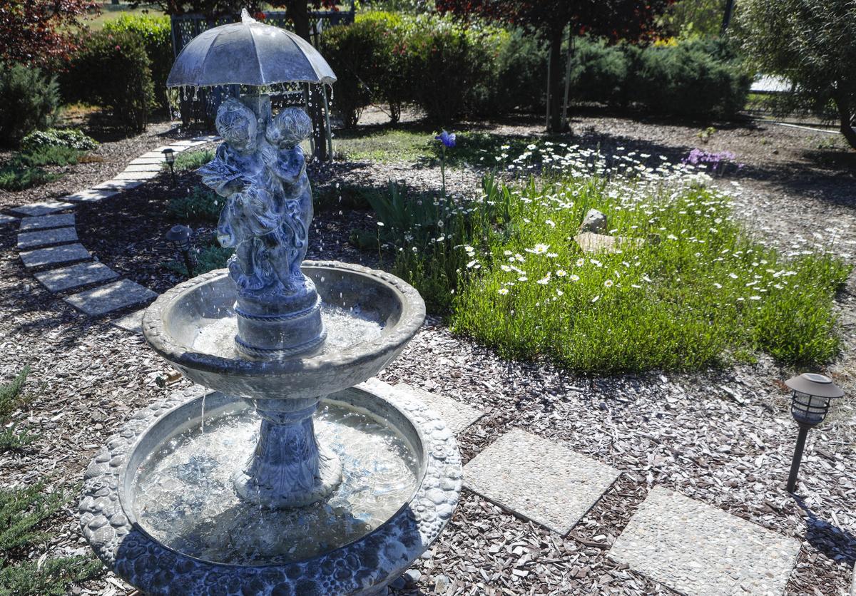 A fountain adds sound and whimsy to Cathy Van Orman’s Atascadero garden.