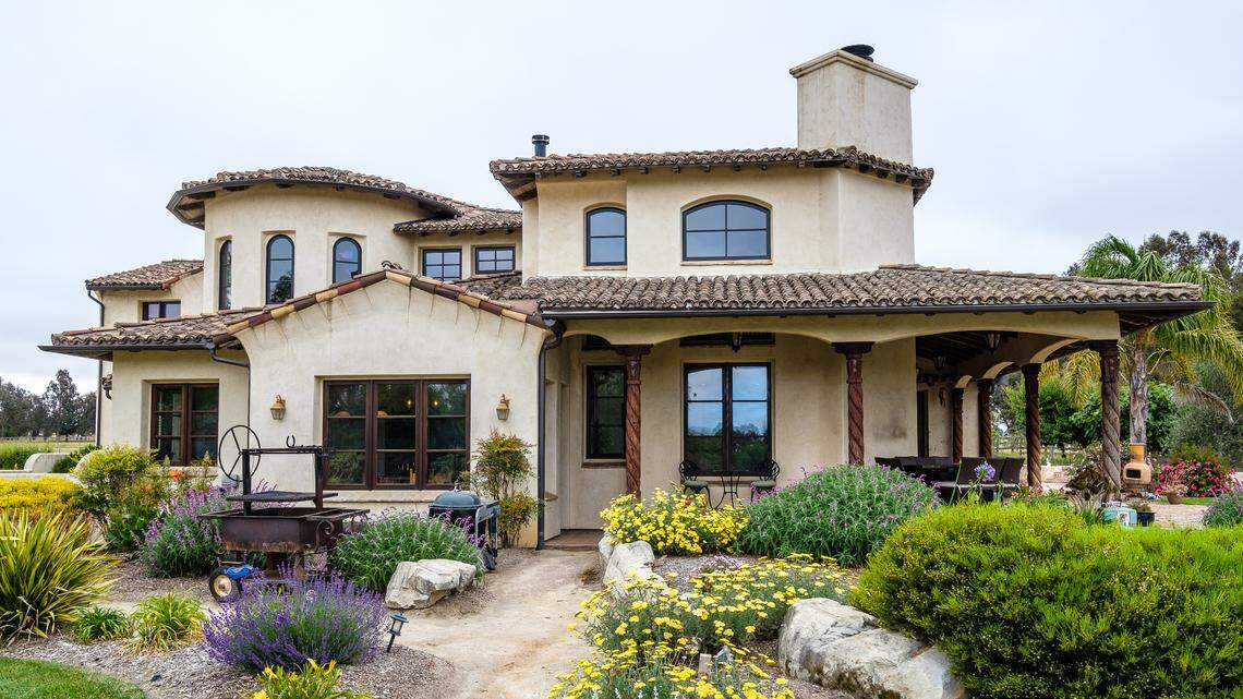 From hard-carved pillars to antique tiles, this Spanish-style home is full of custom touches