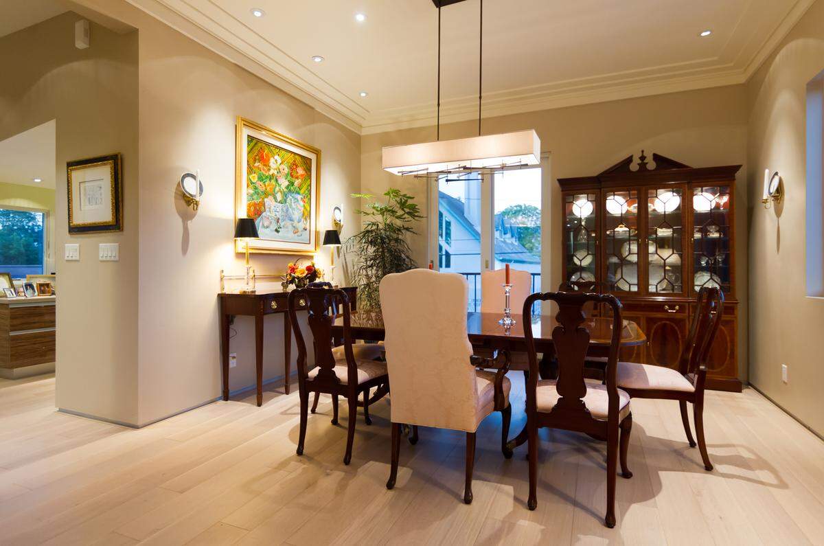 The dining room of Karen and Lee Bren's San Luis Obispo condominium is traditional with intricate inlays.