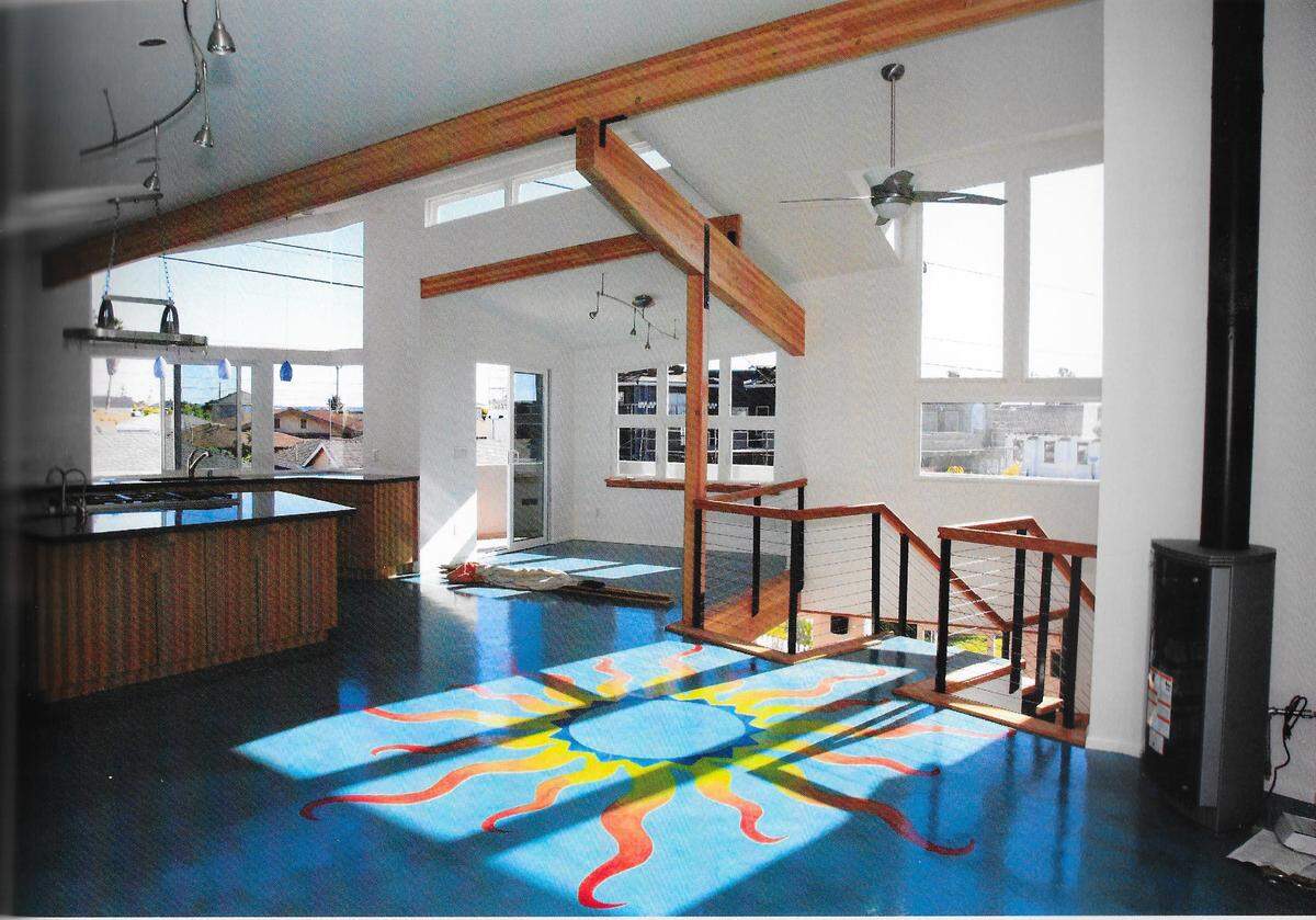 This Shell Beach house is arranged around a two-story indoor entry court with access to an outdoor courtyard.