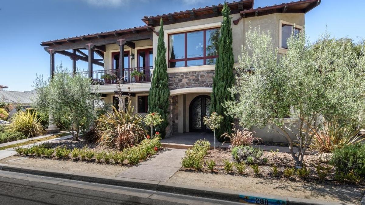The Tuscan-inspired Pajares home in Shell Beach has a stucco exterior and a Roman-style flat pan roof made of clay tiles.