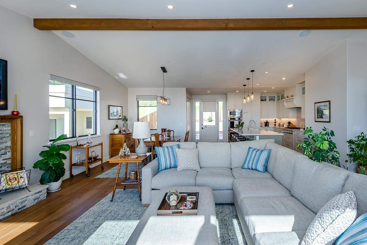 A heavy wood beam spans the width of the ceiling of the great room at John and Dawn Turner’s Cayucos home.