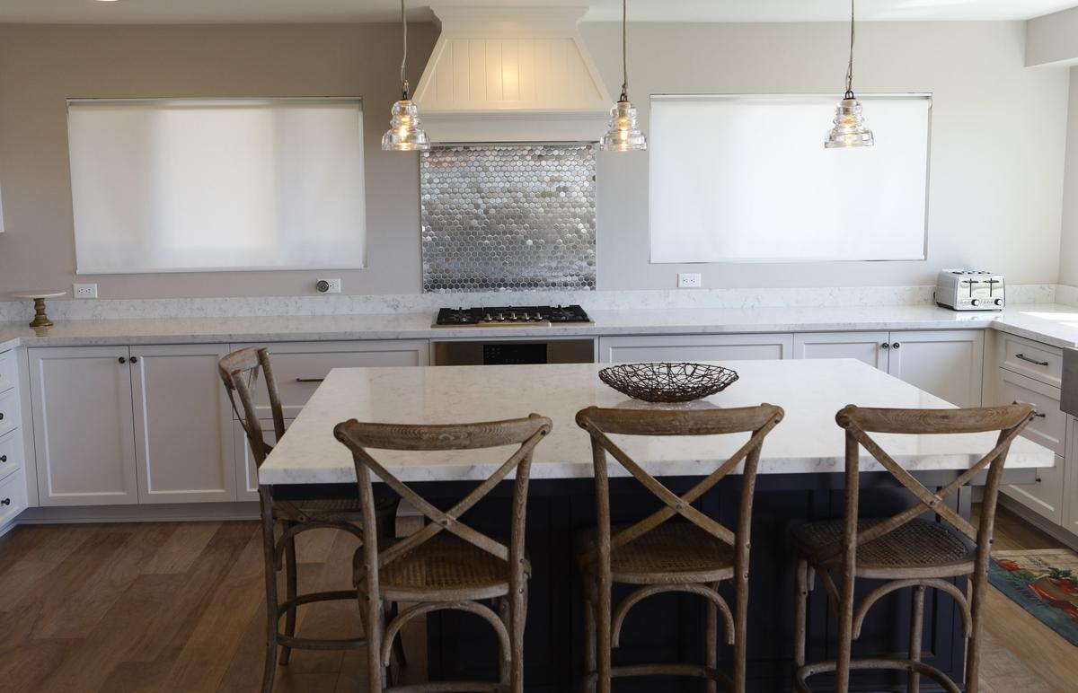 Farmhouse and industrial design elements come together in the kitchen of the Cambria home owned by John and Diane Somers.