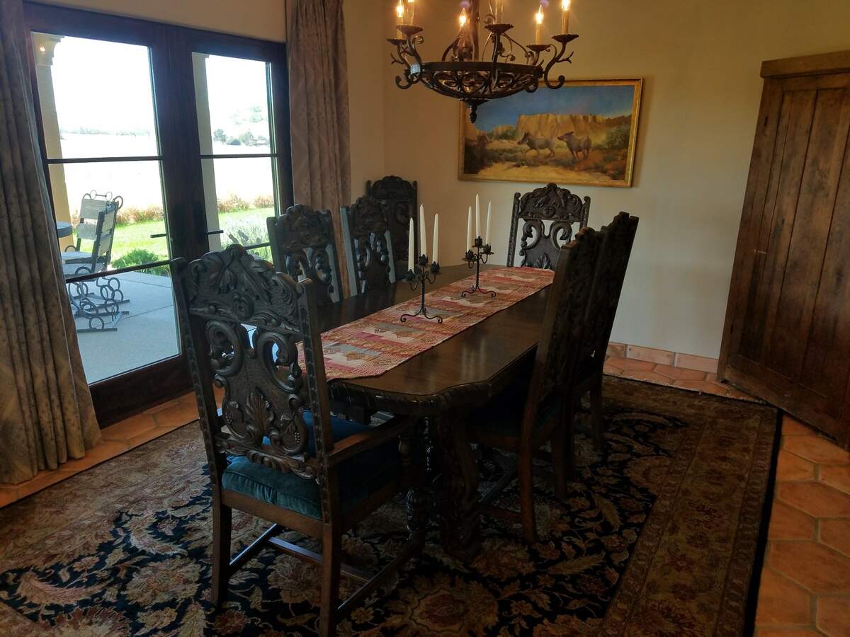The formal dining room of Kim and Dick Rogers' Templeton home features a Jacobean-style dining table and chairs the couple found on Craigslist.