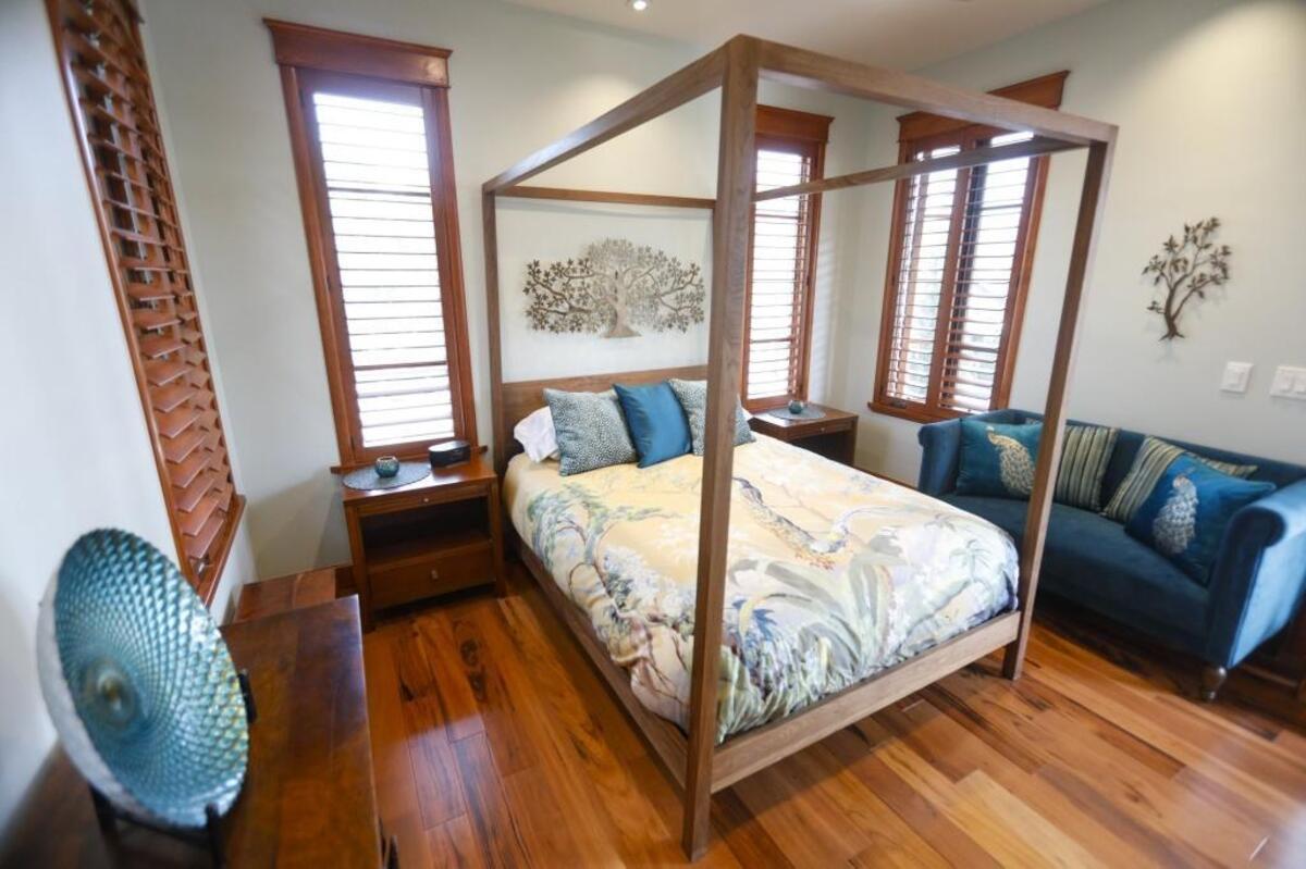 A four-poster bed adds romance to the sleeping space of the Peacock’s Nest, a luxury guest suite in San Lusi Obispo.