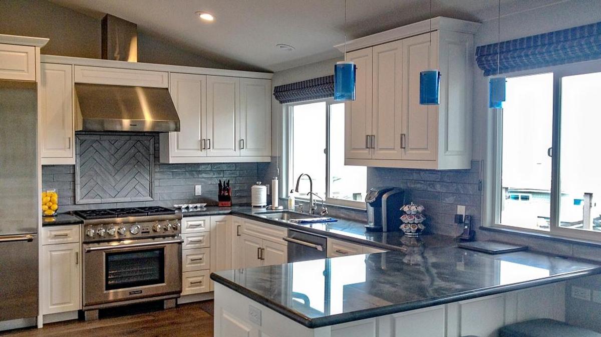 Julie and Larry Beltramo’s contemporary kitchen offers views of the ocean and Shamel Park.