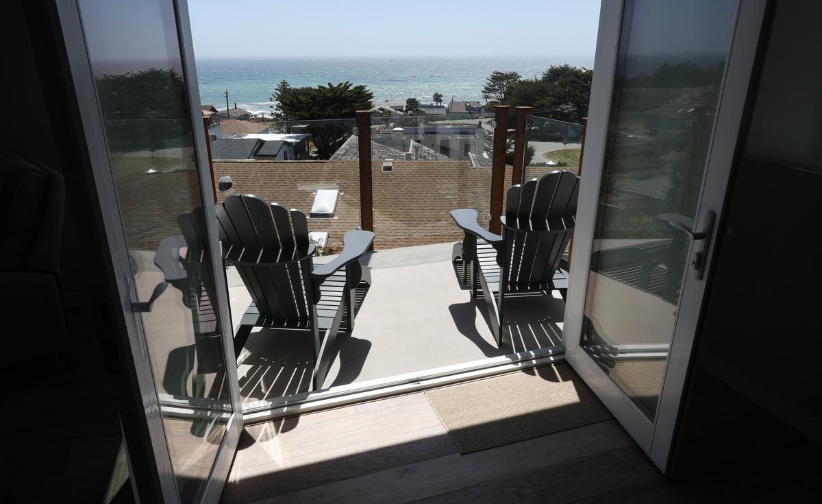 A deck at  John and Diane Somers’ Cambria home offers a strategic spot to take in sweeping ocean views.