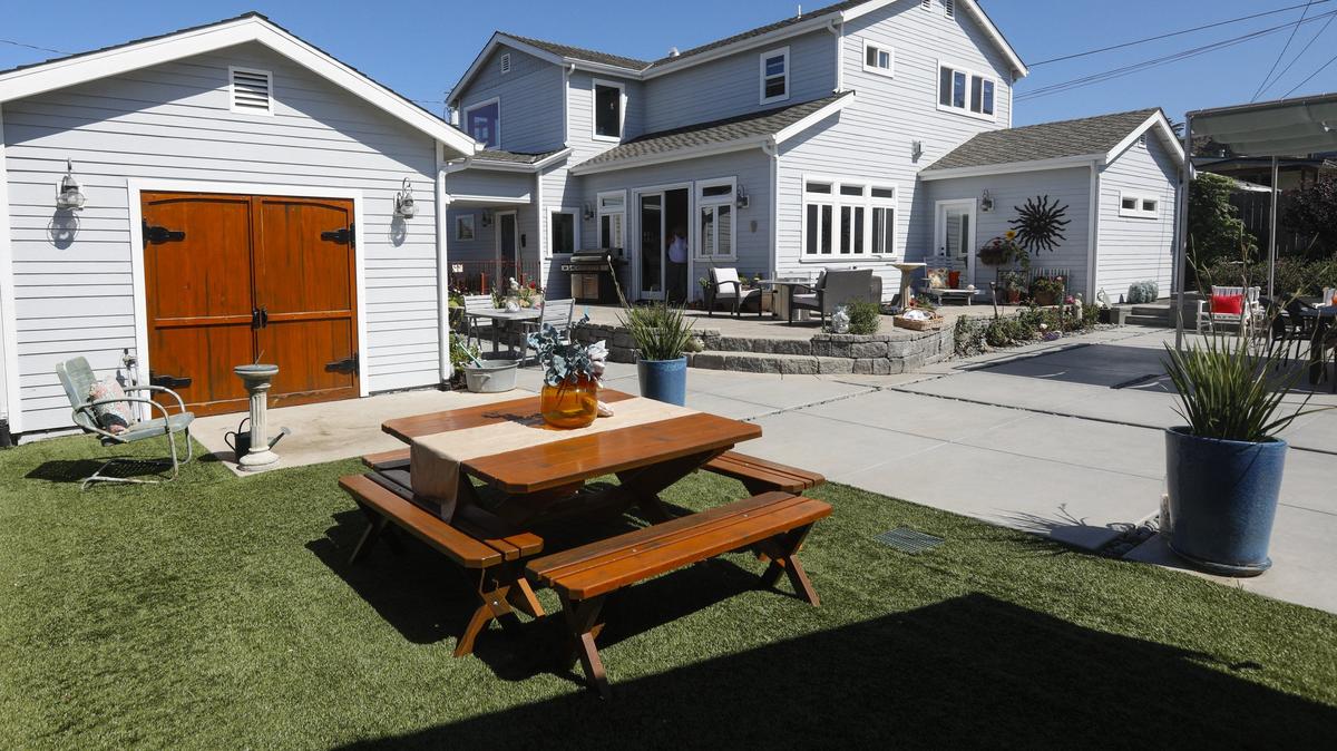 Kathy and Jim Pashone’s multi-level backyard in Cayucos is often the site of lunches, parties and art shows.