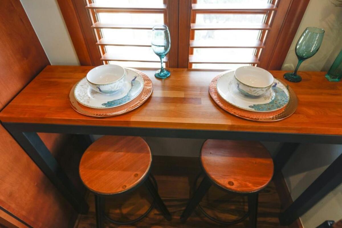 A built-in eating area saves space in the Peacock’s Nest, a San Luis Obispo guest suite.