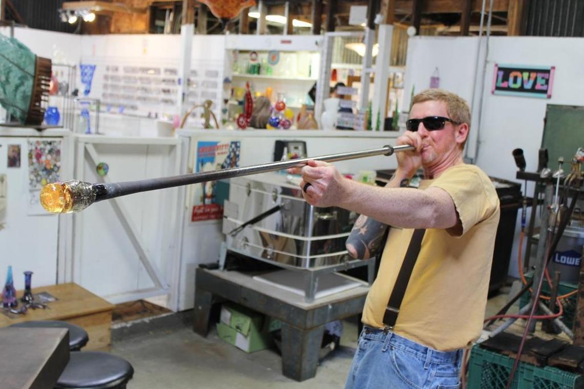Harmony Glassworks owner Eric Dandurand says the typically cool weather in Harmony suits his super-hot glassblowing business.