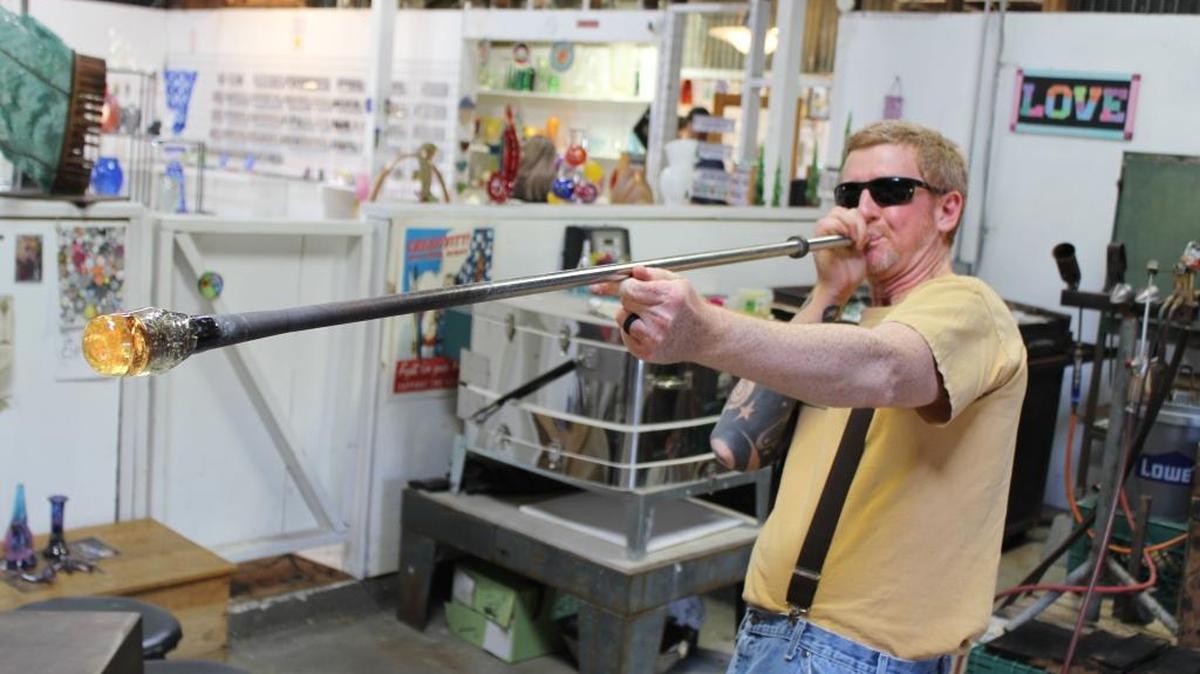 Harmony Glassworks owner Eric Dandurand says the typically cool weather in Harmony suits his super-hot glassblowing business.
