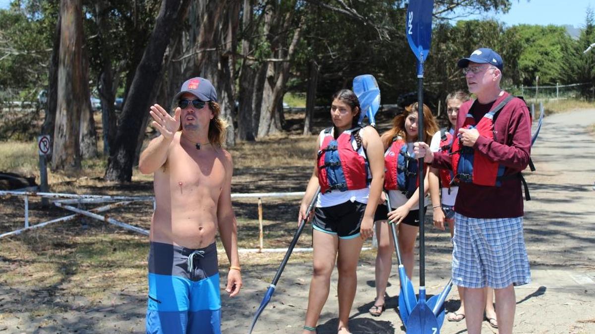 Cubby Cashen, owner of Sea For Yourself Kayak Outfitters, gives some visitors tips for kayaking in San Simeon Cove.