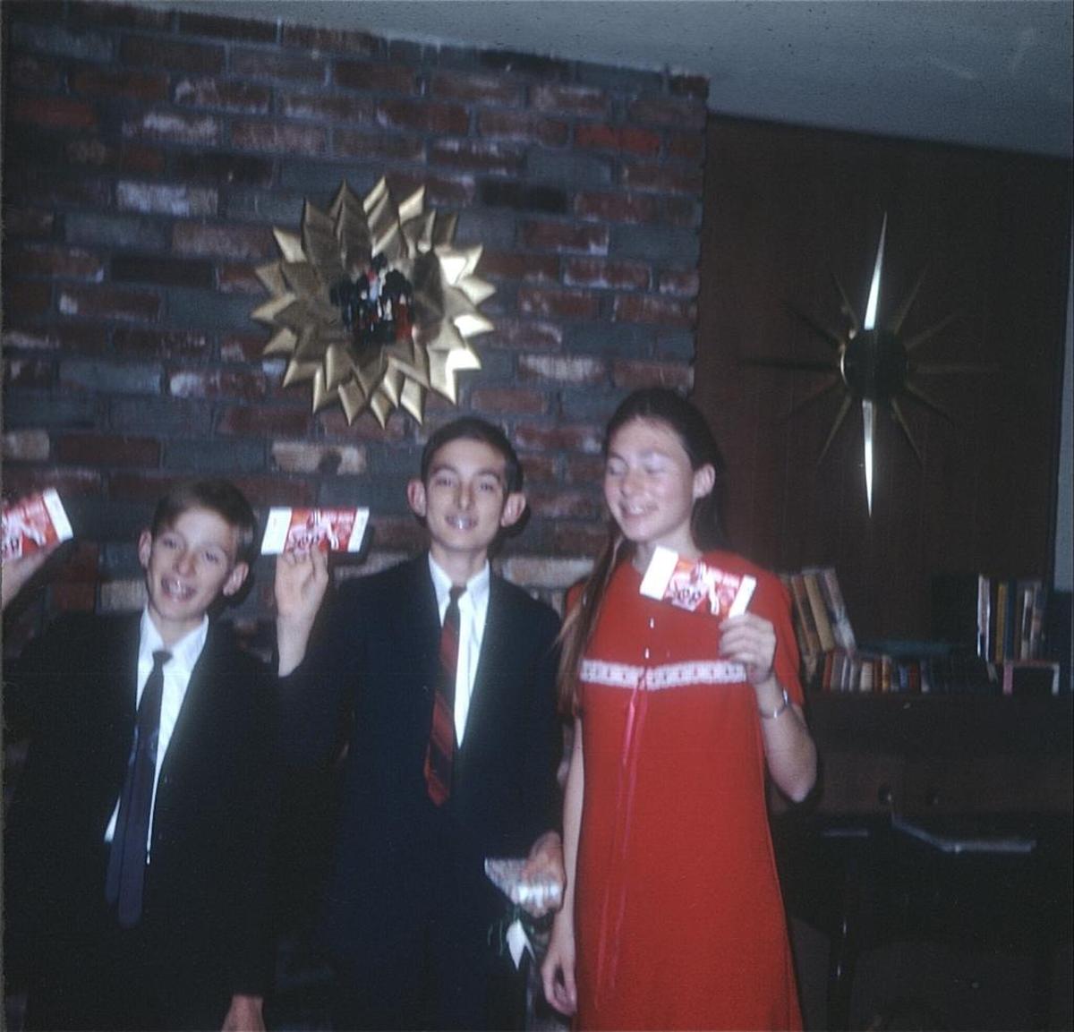 San Luis Obispo resident Theresa Perry, right, and her brothers hold tickets to the 1968 Rose Bowl football game, a gift from their parents.