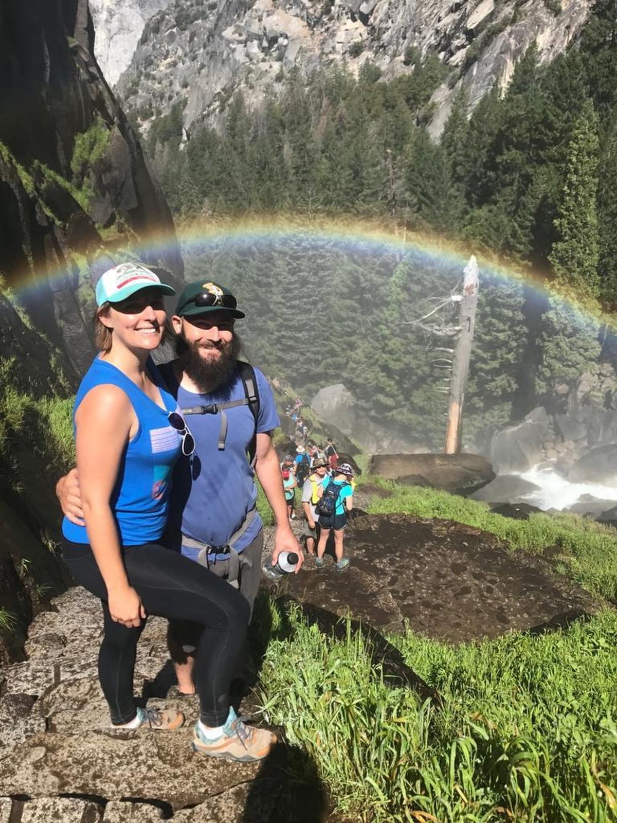 Tribune reporter Monica Vaughan and her husband, Kirk Barron, pose for a photo under a rainbow on the Mist Trail in Yosemite National Park.