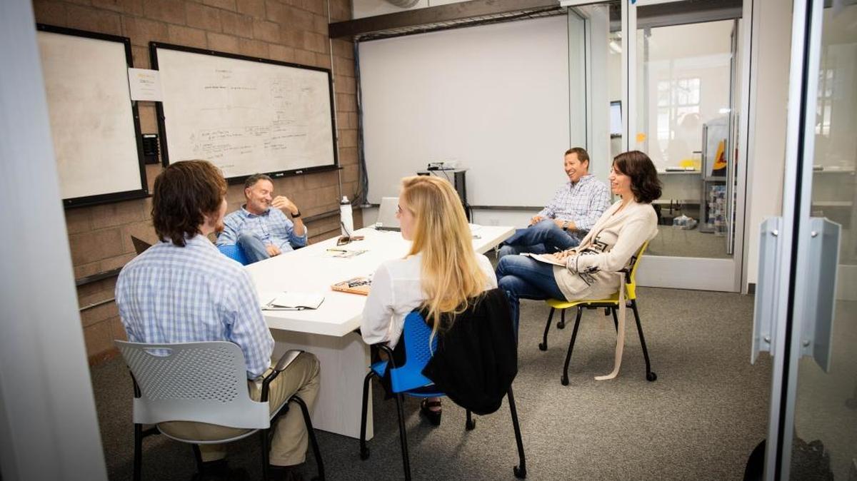 The new space for the SLO HotHouse program on Higuera Street offers meeting rooms and workspace for startups. Pictured here are, left to right, Luke Fox of the startup WhiteFox; Jonathan York, co-founder of the Center for Innovation and Entrepreneurship; Katie White of WhiteFox; Dr. Thomas Katona, CIE faculty advisor; and Lori Jordan, CIE director of student innovation programs.