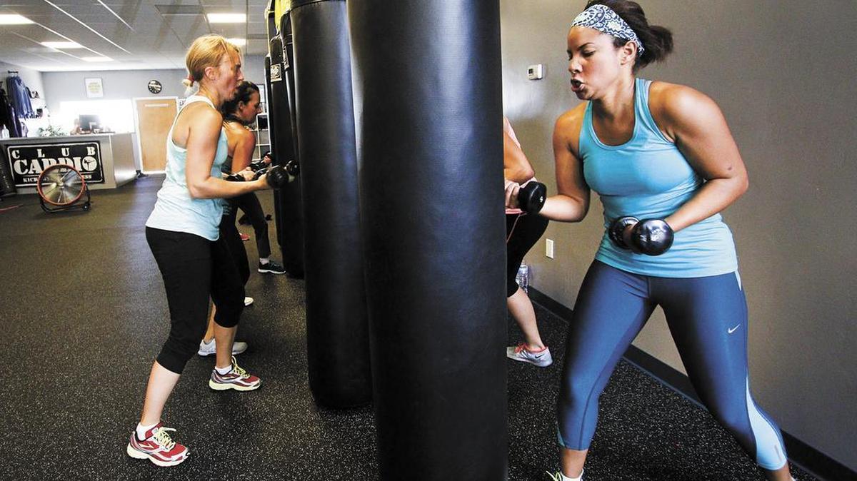 Clients work the punching bag at Club Cardio in Grover Beach.