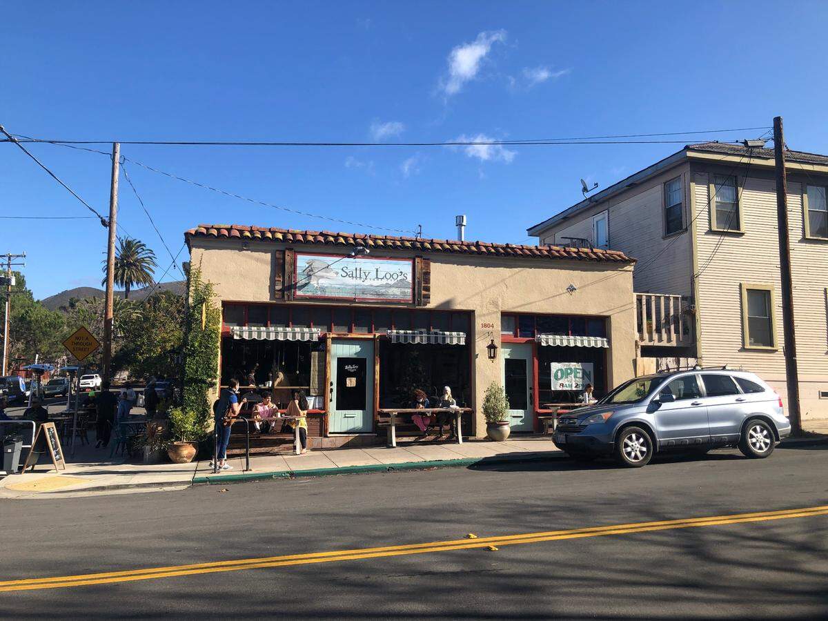 Customers dine at Sally Loo’s Wholesome Cafe on New Year’s Eve after the business received two citations from the city.