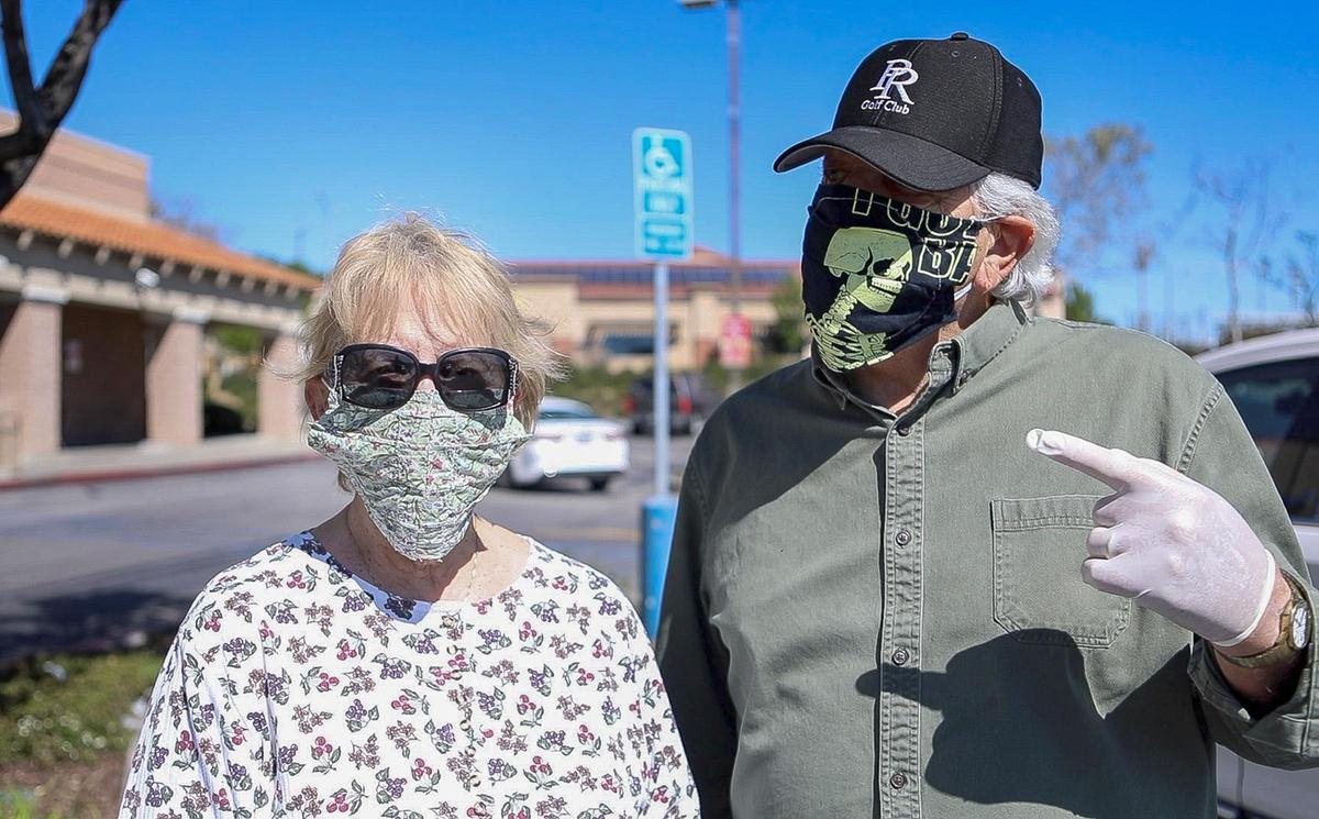 Donna and Richard Thiel talk about their use of masks after shopping at Albertsons in Paso Robles, which is requiring shoppers to wear face coverings or they won’t be allowed in the store.