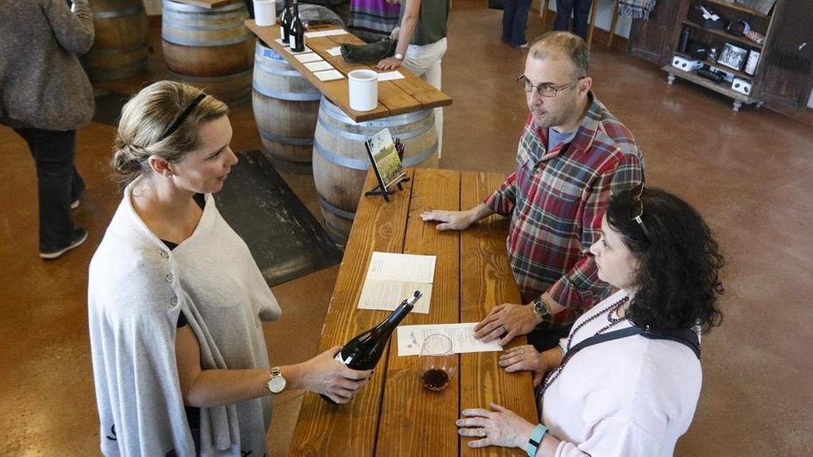 Darren and Shawn Selsky from Austin, Texas, have vacationed in Napa/Sonoma for the last 10 years, but when wildfires broke out in the area, their hosts recommended Paso Robes as an alternative. Serving is Melissa Swanson, director of hospitality at Alta Colina. The winery is among those in the Paso Robles area that have seen an upswing in visits as Napa/Sonoma tourism diverts in the wake of devastating fires.