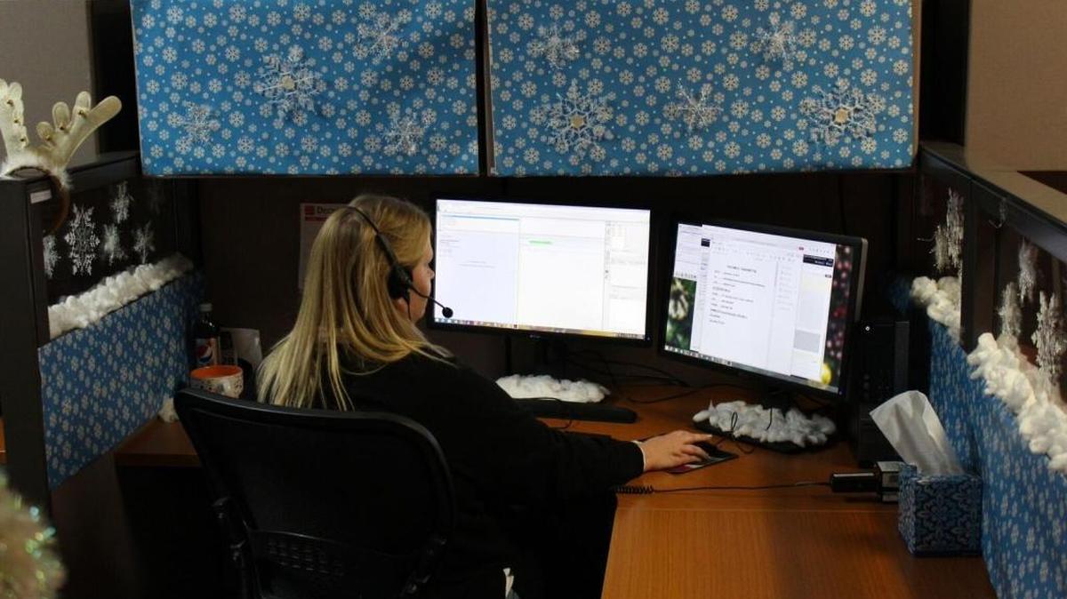 Allison Quackenbush handles reception at Advantage Answering Plus. The company offers a free Santa Claus hotline during the holidays.