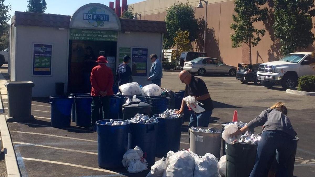 A line forms outside of the recycling center behind Target in San Luis Obispo as people wait for the center to open in the morning.