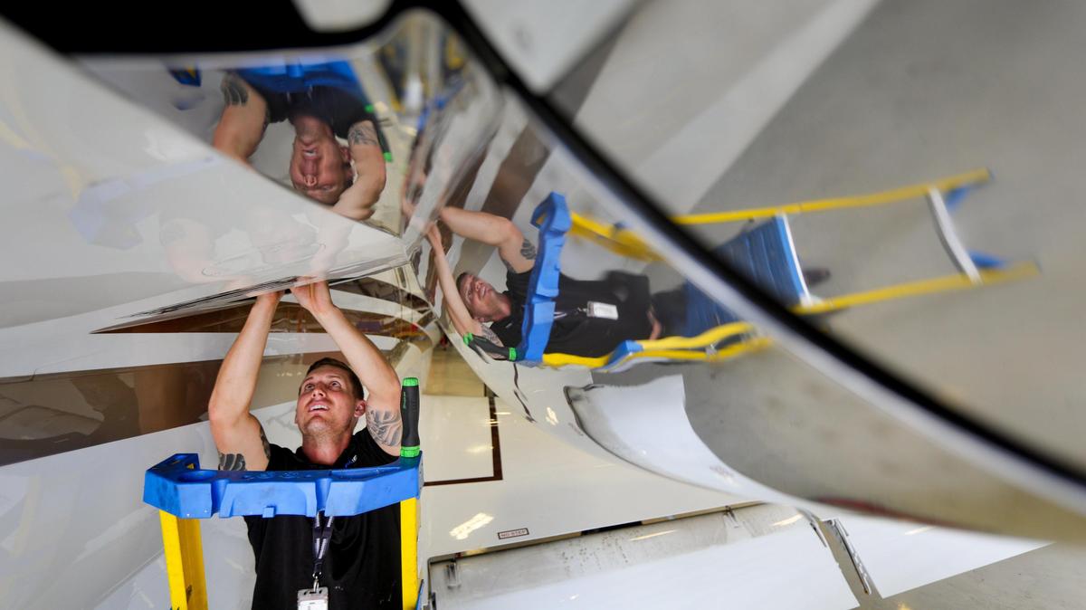 Aircraft technician Landon Brooks changes a component while servicing a jet. ACI Jet, headquartered in San Luis Obsipo, has been authorized to service Bombardier company aircraft, helping ACI grow by 30 percent and hire 15 new employees. San Luis Obispo County Regional Airport is the home of the California business.