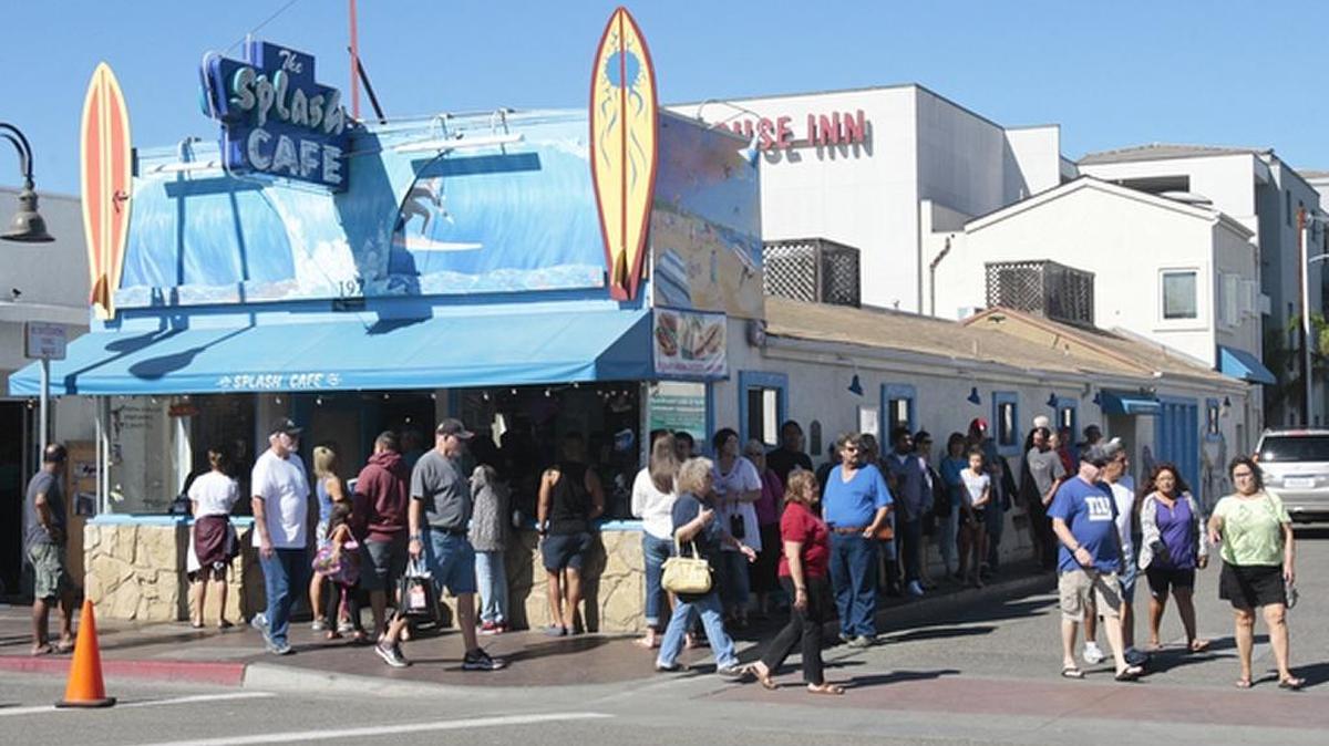 The line outside Splash Cafe wraps around the building during the 69th annual Clam Festival in October 2015.