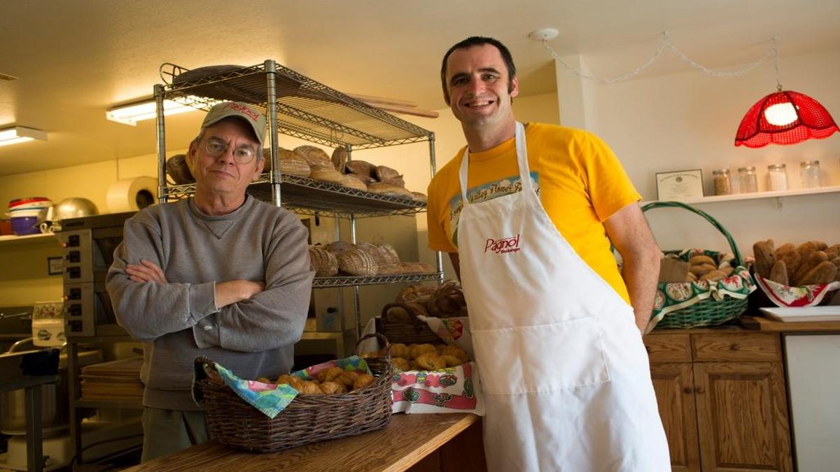 Mark Stambler, left, and Marcus Marren prepare for last month’s open house at Pagnol at Third Street Bakery in Los Osos.