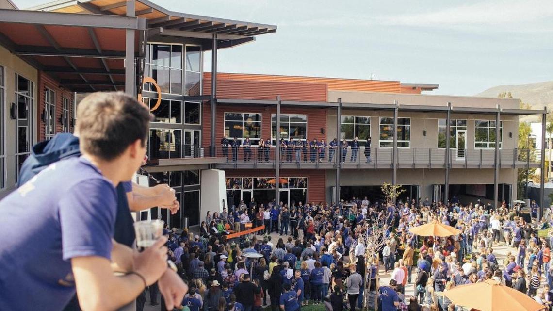 Employees of MindBody celebrate the grand opening of its campus in San Luis Obispo in 2015.