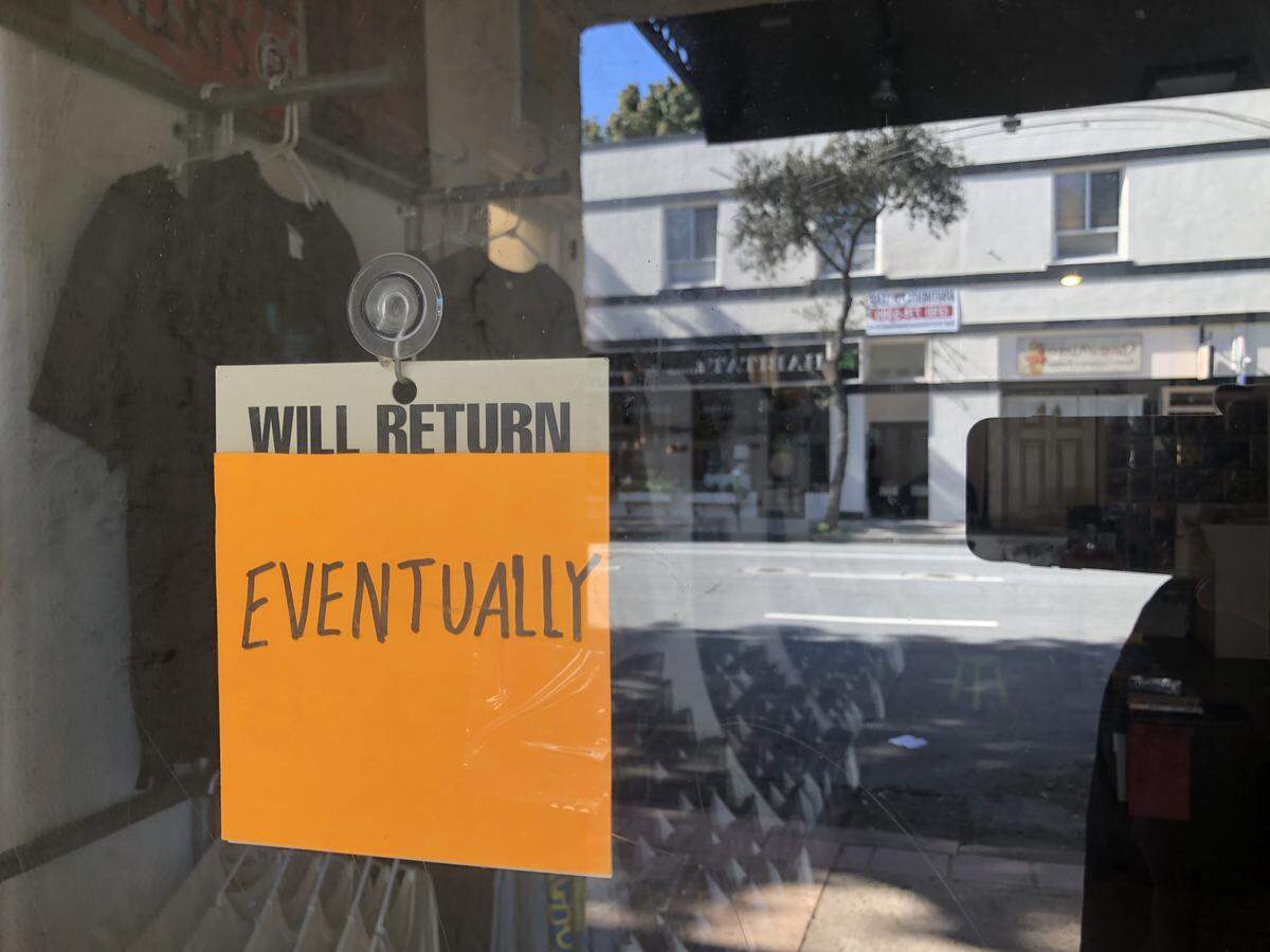 A sign posted in April in a downtown San Luis Obispo shop window illustrates the uncertain nature of the closures that occurred early in the pandemic.