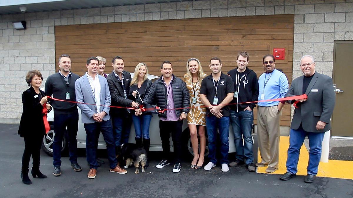 Coastal Delivery SLO is the first cannabis delivery business in San Luis Obispo to open for operations. The entire crew lines up in front of the business for a ribbon cutting with the San Luis Obispo Chamber of Commerce.