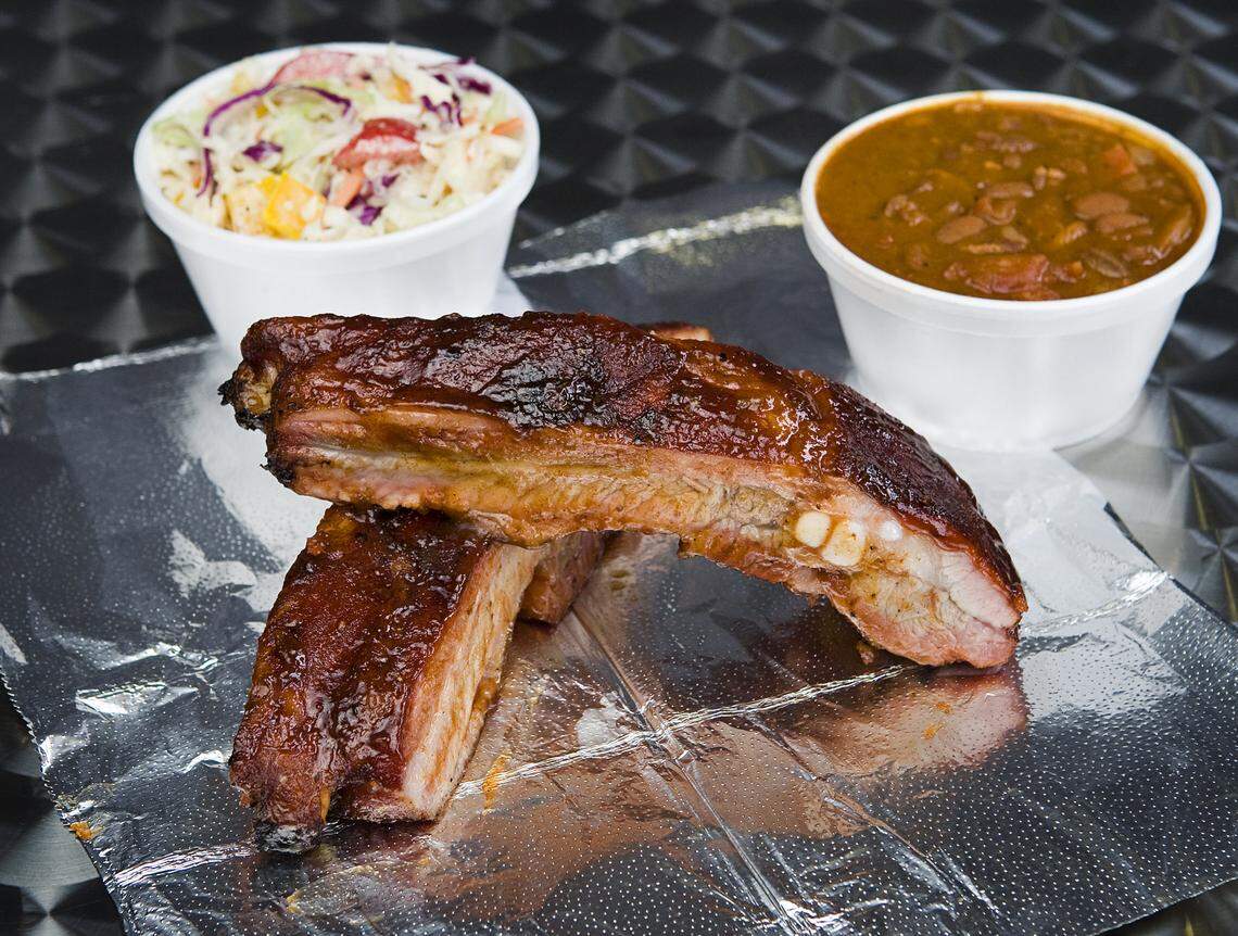 At Brickhouse BBQ in Morro Bay, ribs are served with sides of coleslaw and tri-tip beans The restaurant recently moved to a new location.
